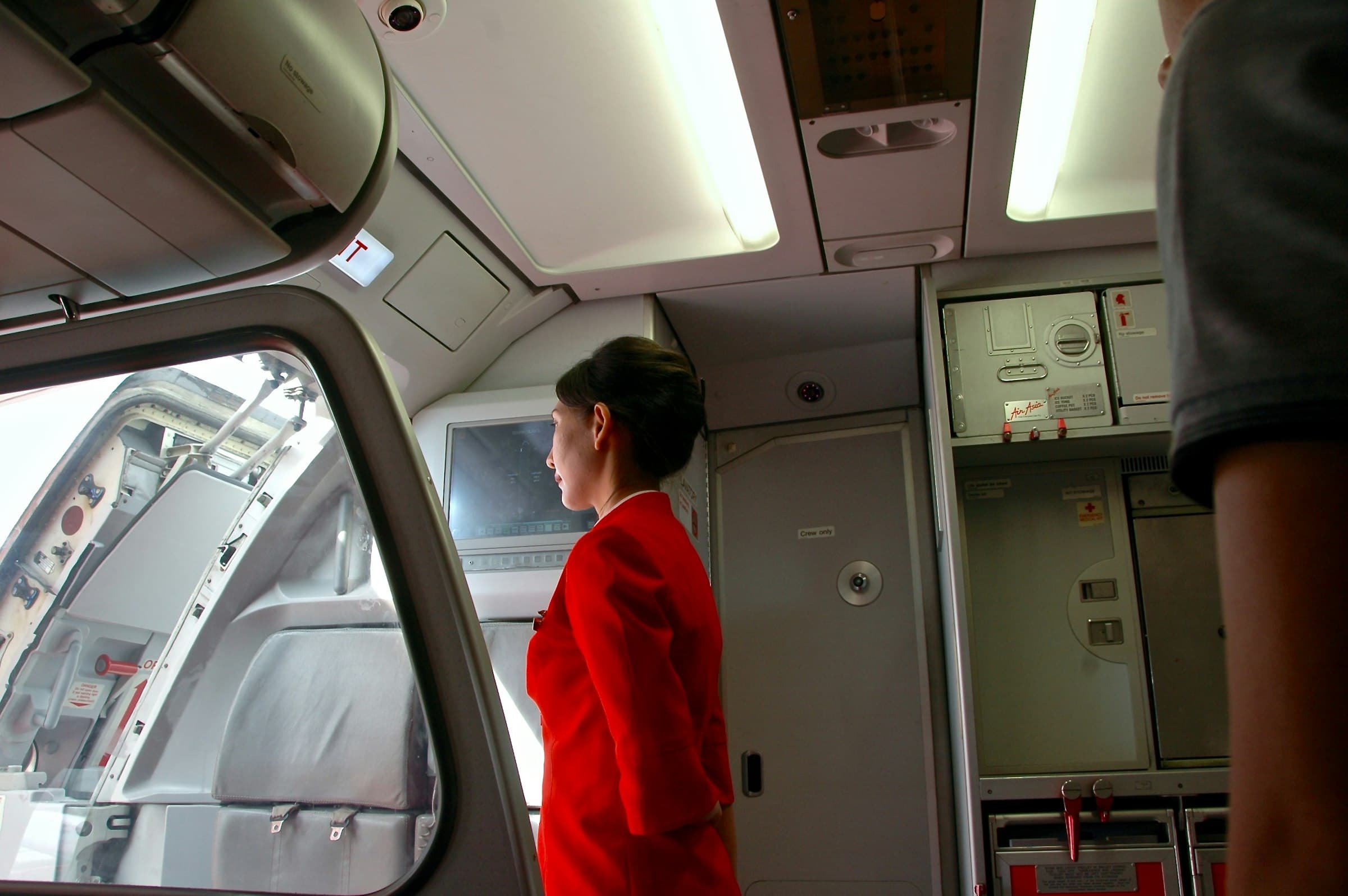 Cabin crew trainee during in-flight service practice