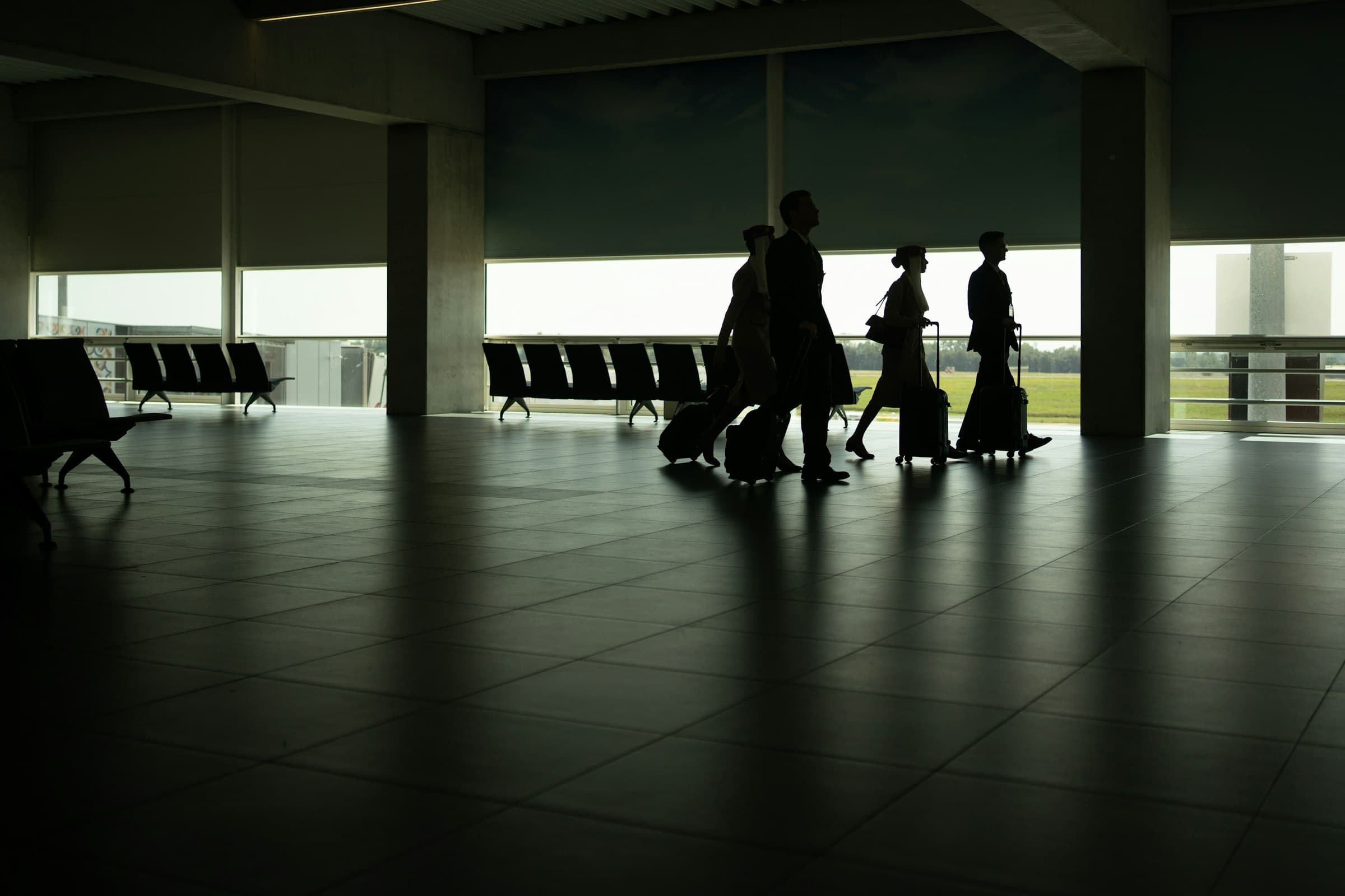 Cabin crew walking through an airport terminal